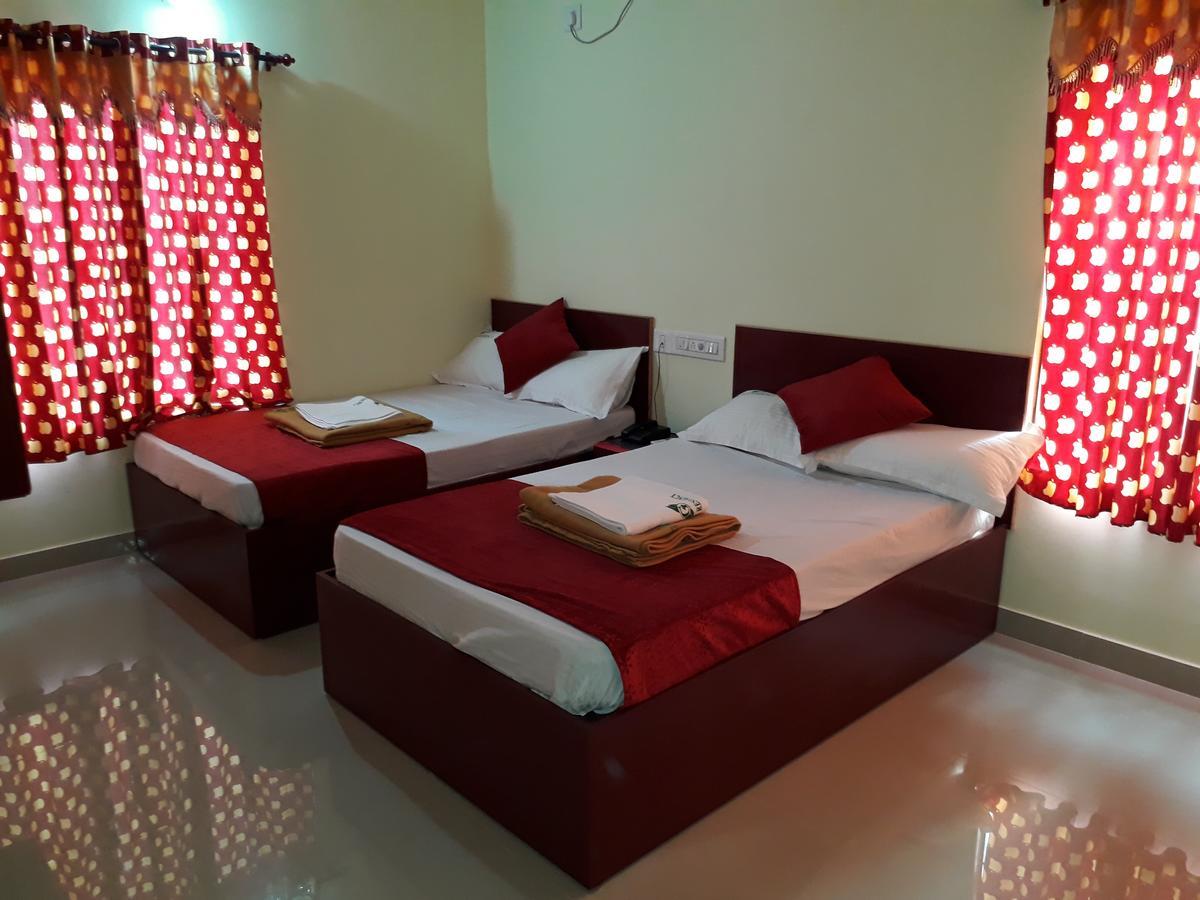 Hotel Ganga Residency Kuzhittura Bagian luar foto